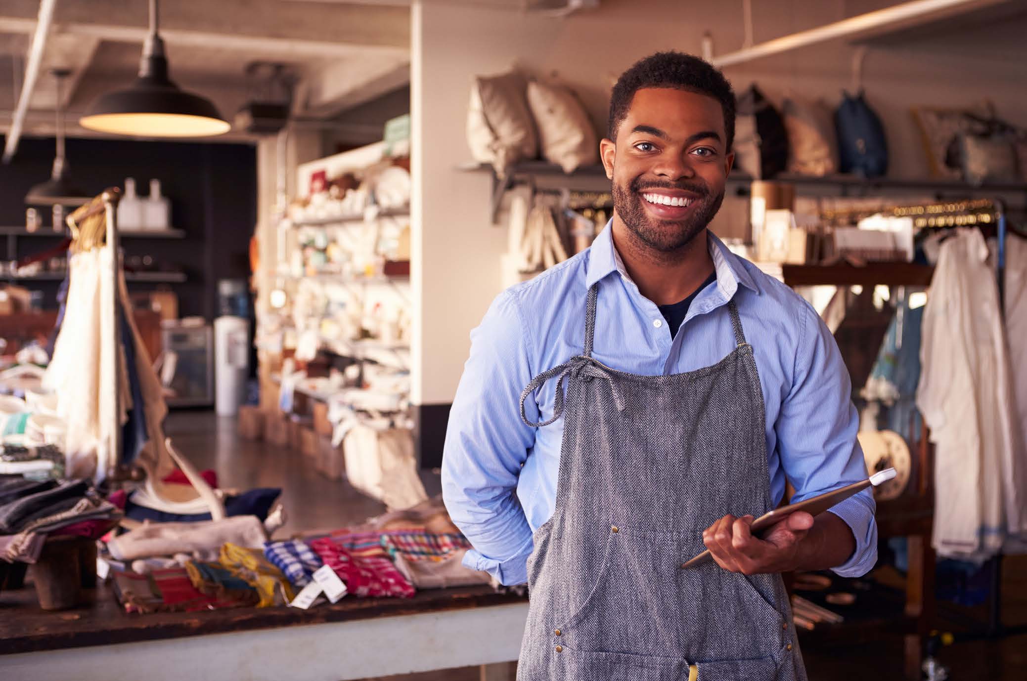 Male business owner smiling